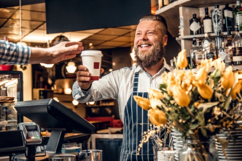 Male handing out coffee
